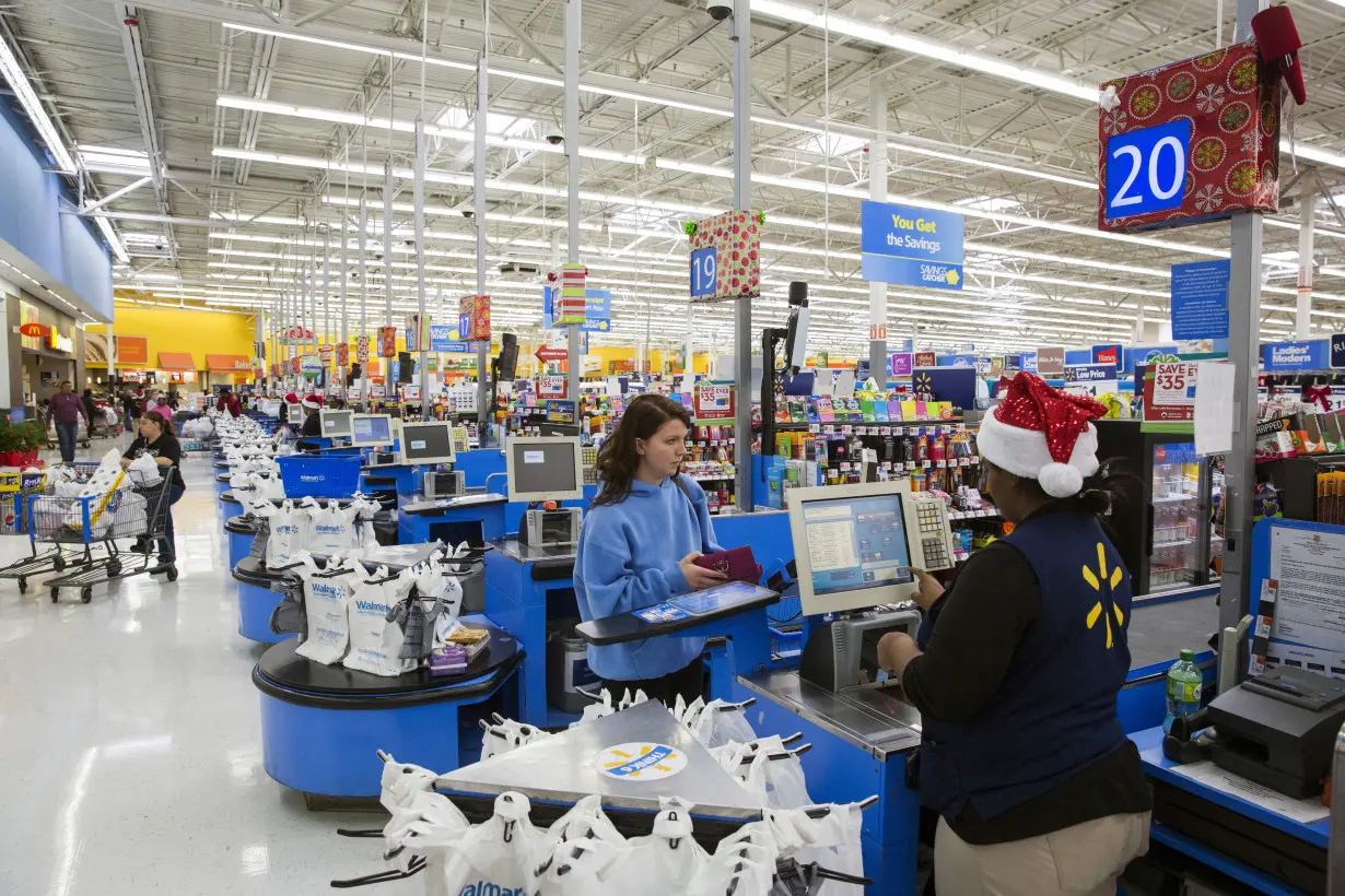 FILE PHOTO: A shopper checks out at a Walmart store in Secaucus, New Jersey