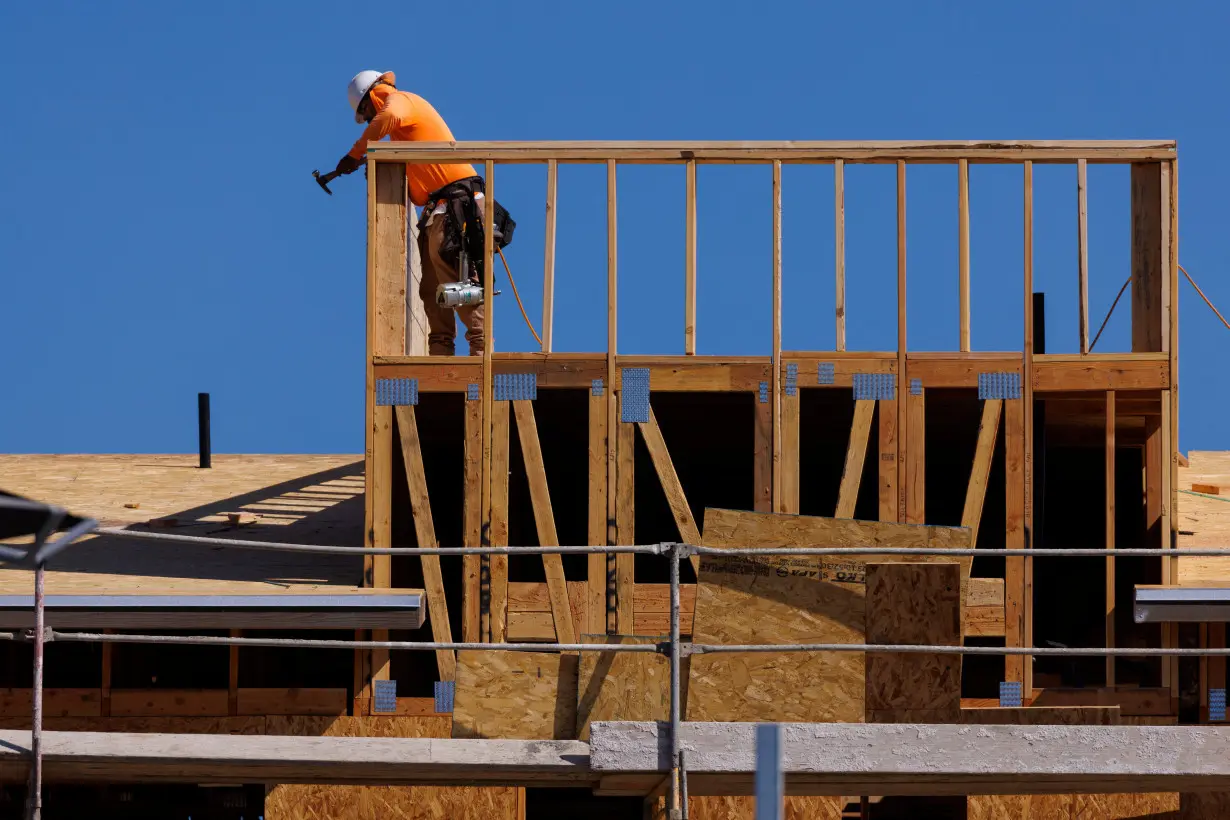 New contemporary attached residential homes are shown under construction in California