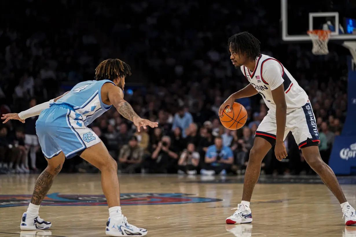 Spencer scores 23 to lead No. 5 UConn past No. 9 North Carolina 87-76 in Jimmy V Classic at MSG