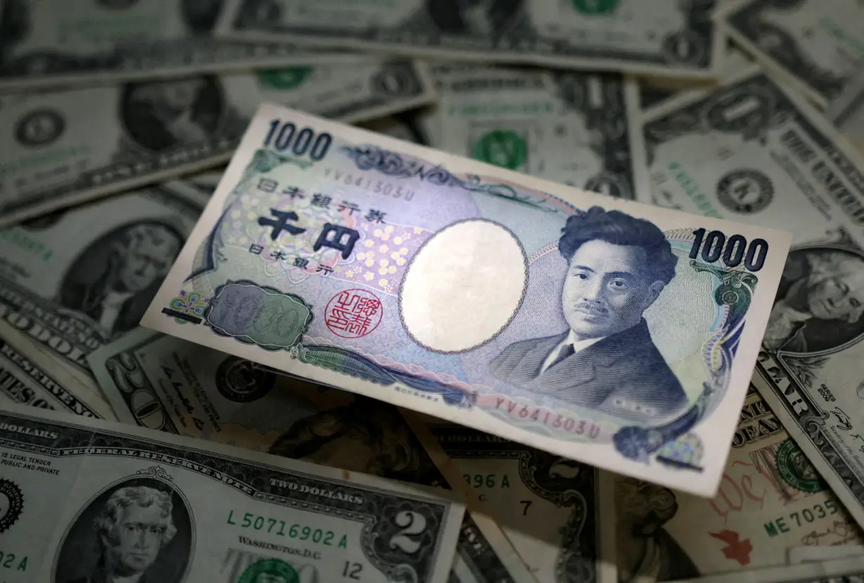 FILE PHOTO: FILE PHOTO: Illustration shows Japanese Yen and U.S. dollar banknotes