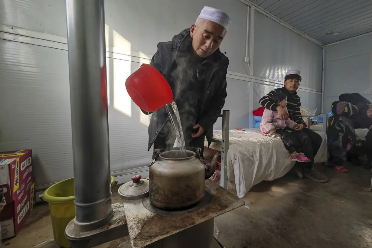 China has started erecting temporary housing units after an earthquake destroyed 14,000 homes