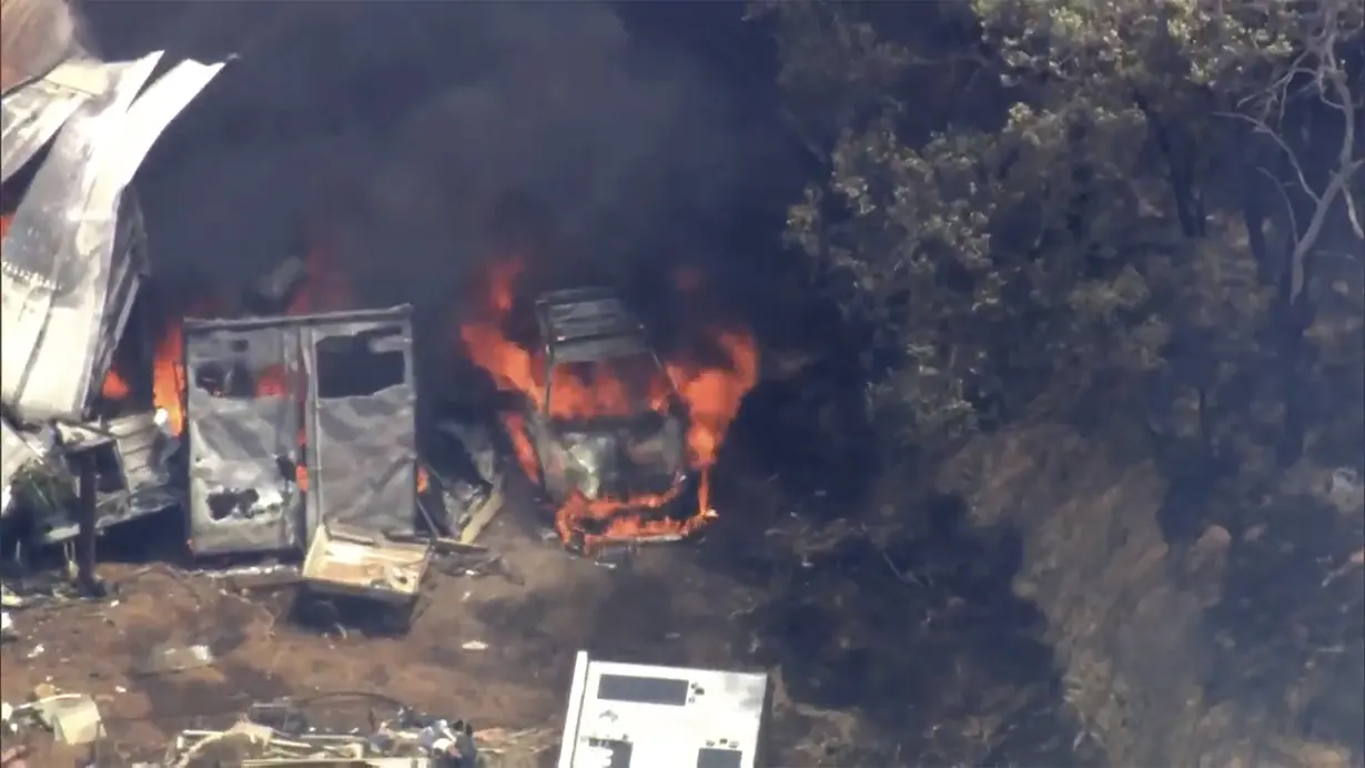 A wildfire in Australia on the outskirts of Perth destroys at least 2 homes and injures 2 people