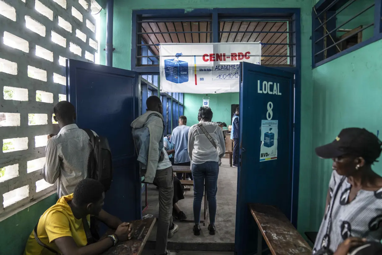 Congo conducts a 2nd day of voting after delays and closed polls keep people from casting ballots