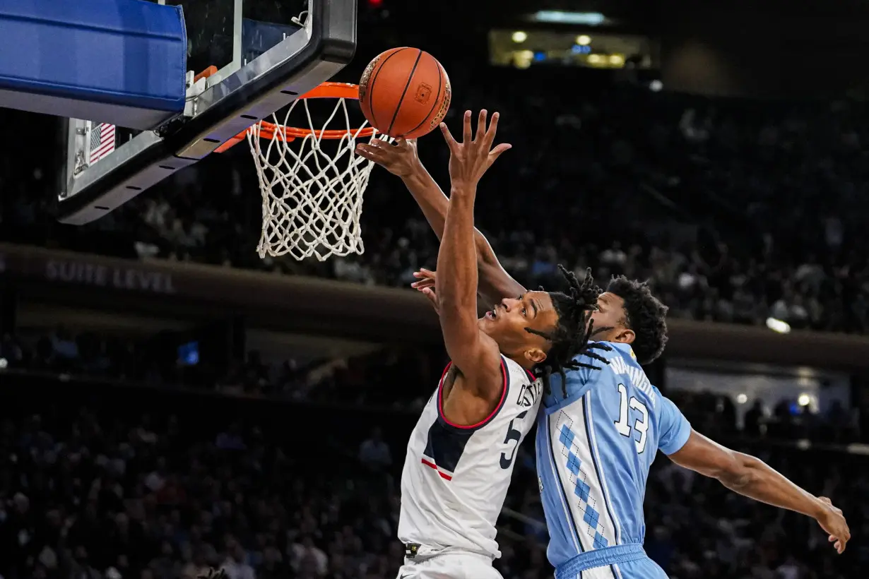 Spencer scores 23 to lead No. 5 UConn past No. 9 North Carolina 87-76 in Jimmy V Classic at MSG