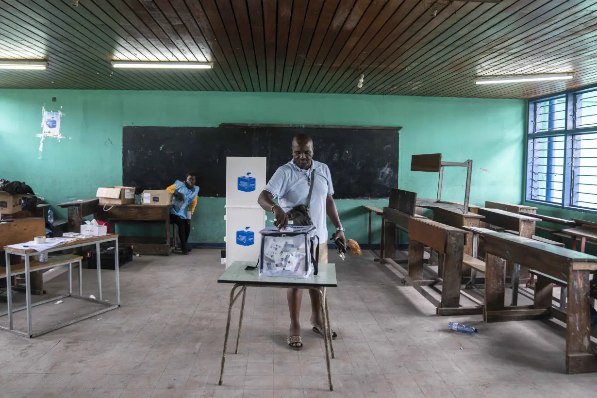 Congo conducts a 2nd day of voting after delays and closed polls keep people from casting ballots