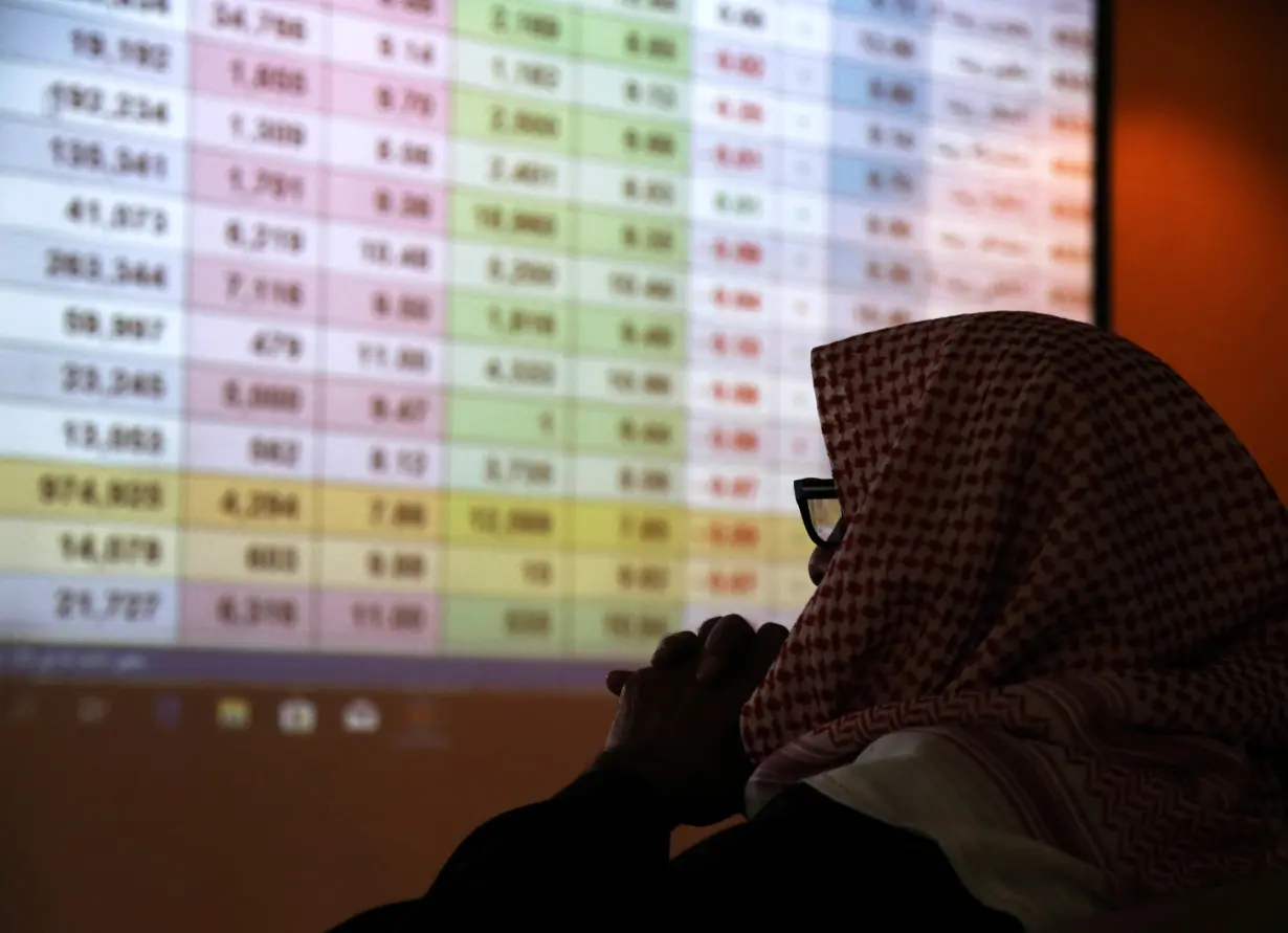 A Saudi trader monitors stocks at the Saudi stock market in Riyadh