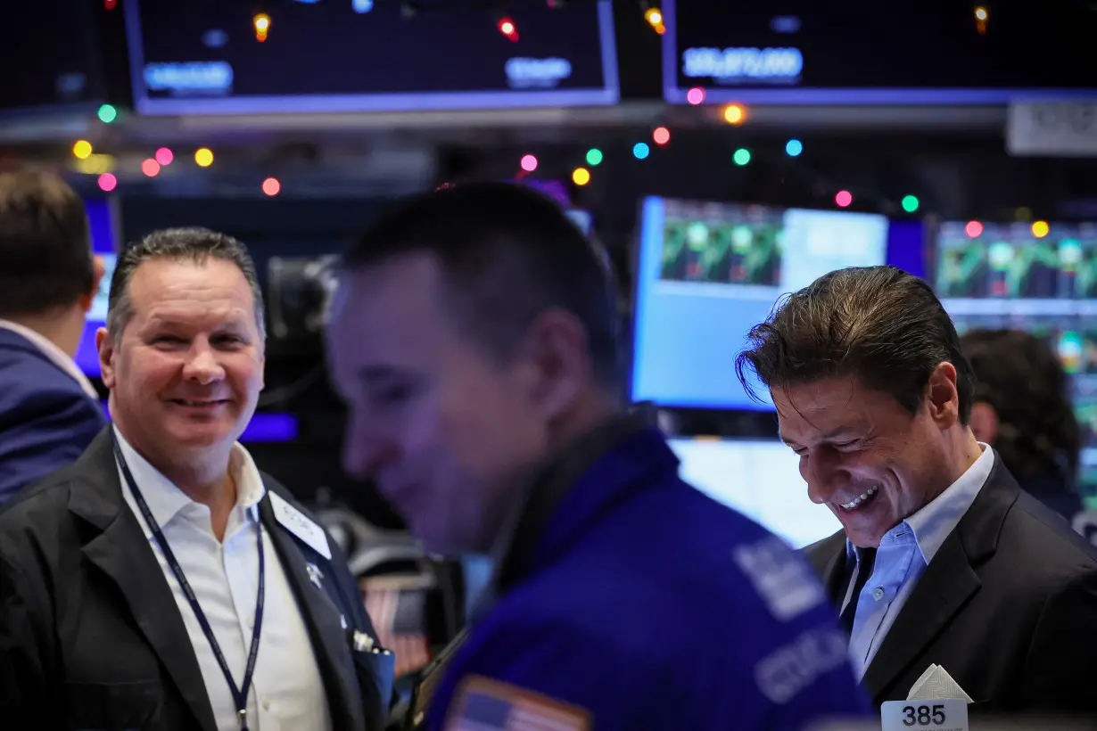 Traders work on the floor of the NYSE in New York