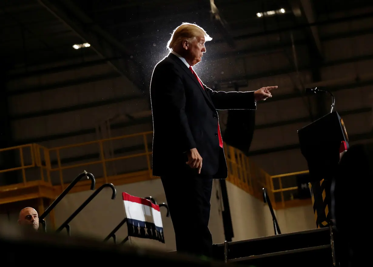 United States President Trump gestures during a campaign rally in Pensacola