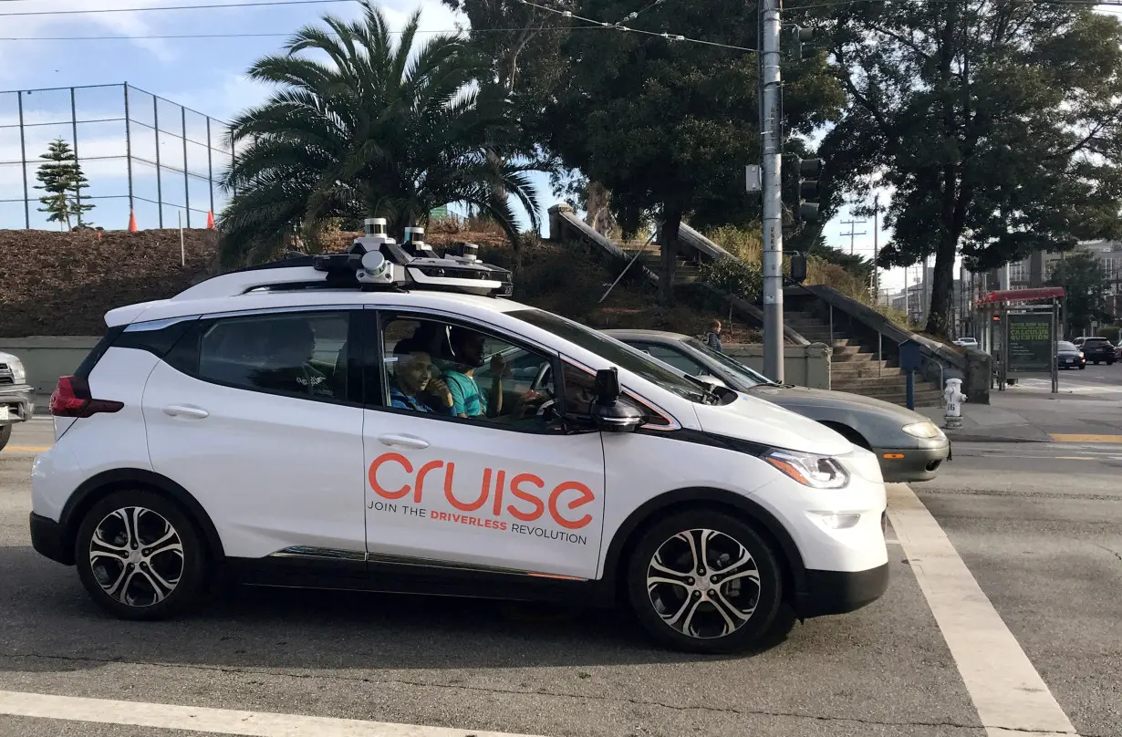 FILE PHOTO: A Cruise self-driving car, which is owned by General Motors, is seen outside the company’s headquarters in San Francisco