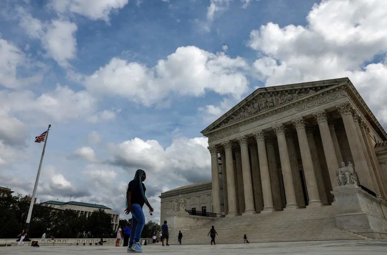 FILE PHOTO: Visitors outside the U.S. Supreme Court buidling in Washington