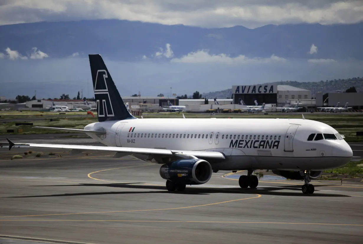 A Mexicana Airlines Airbus A320 passenger jet is seen at the Benito Juarez international airport in Mexico City