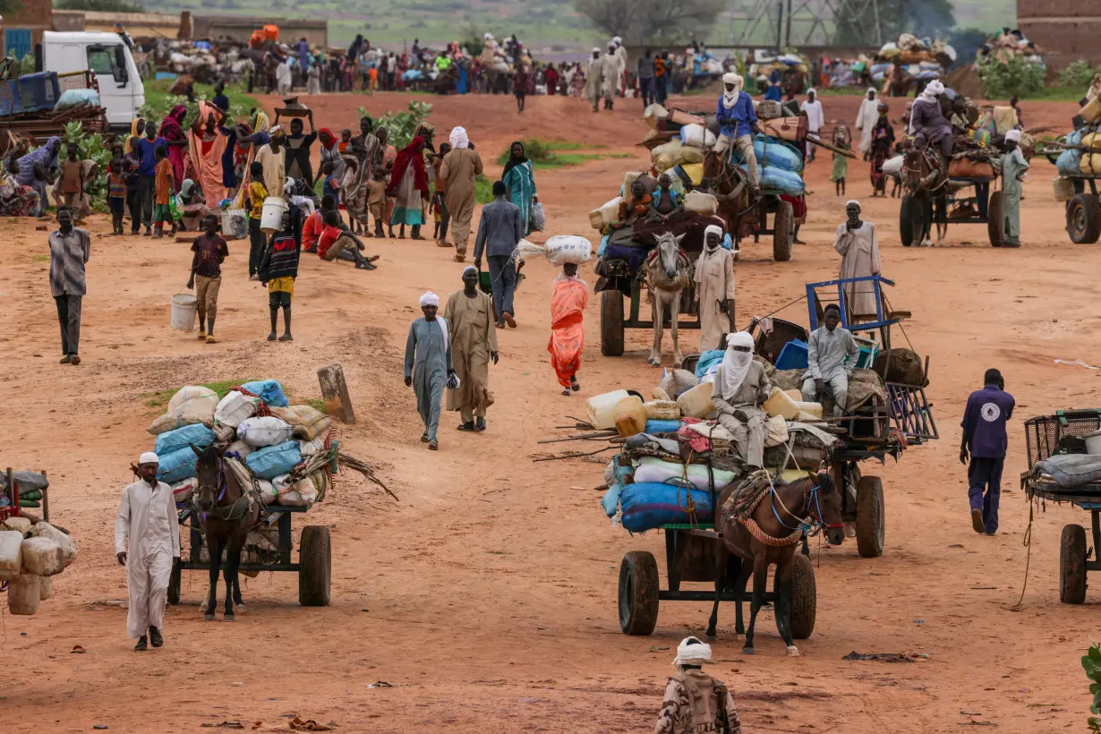 FILE PHOTO: People fleeing the violence in West Darfur