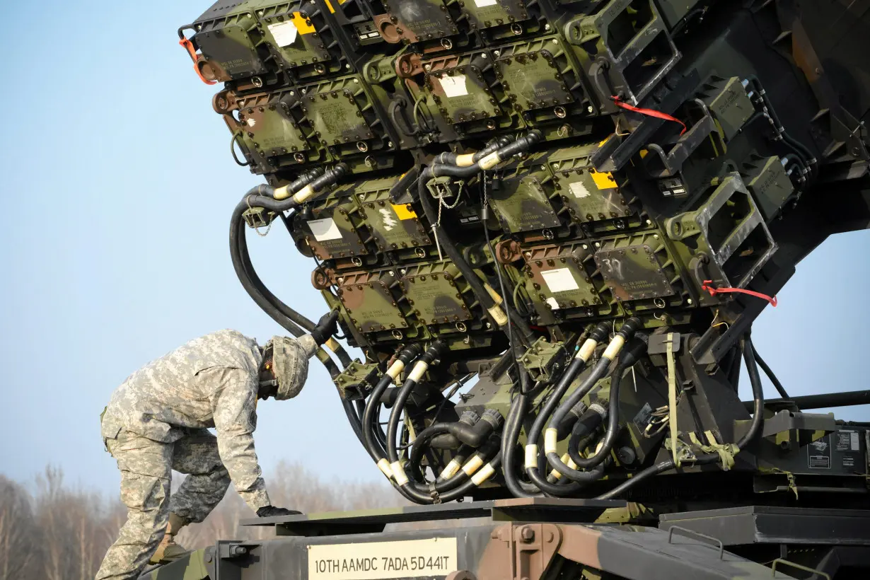 FILE PHOTO: A U.S soldier inspecys a Patriot missile defence battery during join exercises at the military grouds in Sochaczew