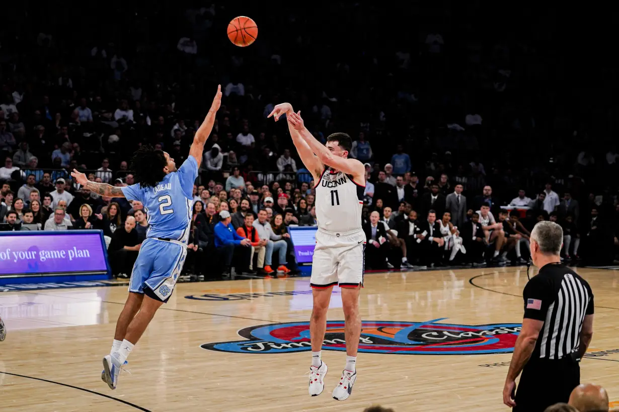 Spencer scores 23 to lead No. 5 UConn past No. 9 North Carolina 87-76 in Jimmy V Classic at MSG