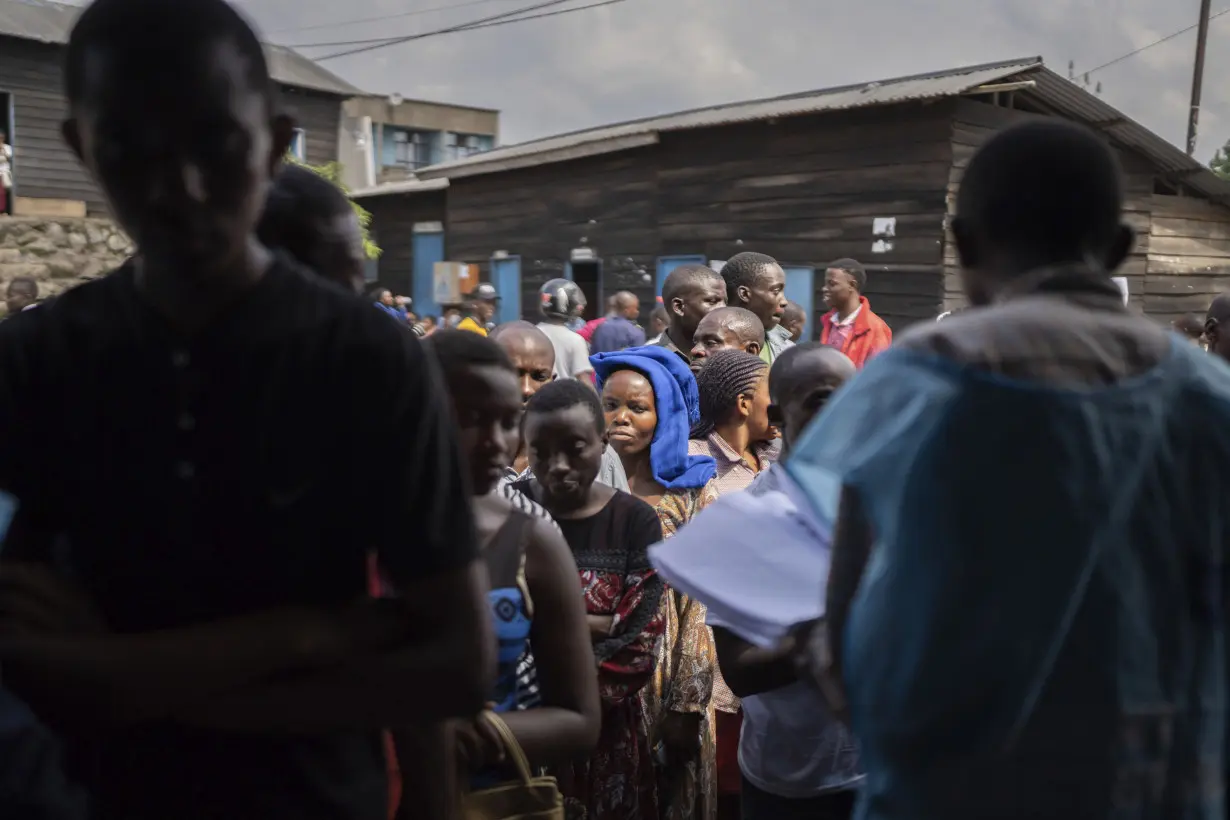 Congo conducts a 2nd day of voting after delays and closed polls keep people from casting ballots