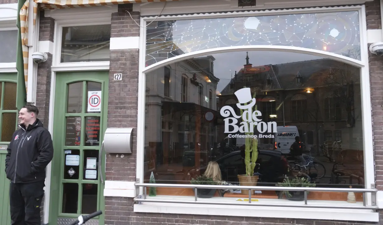 Shops in 2 Dutch cities start selling legally grown cannabis in an experiment to regulate pot trade