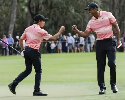 Kuchar and son build 3-shot lead. Tiger Woods and son have to settle for a nice family affair