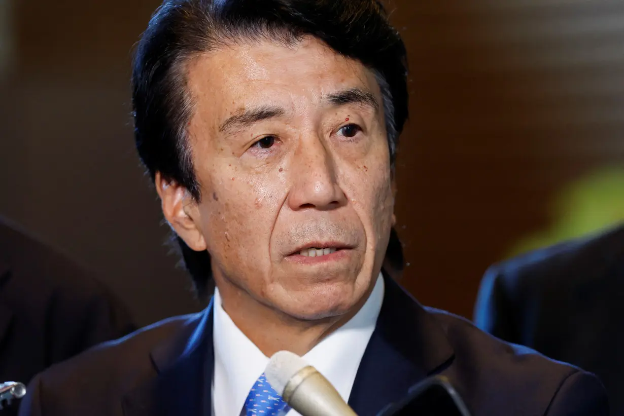 Japan’s incoming Economy, Trade and Industry Minister Ken Saito speaks to media at Prime Minister Fumio Kishida's official residence in Tokyo