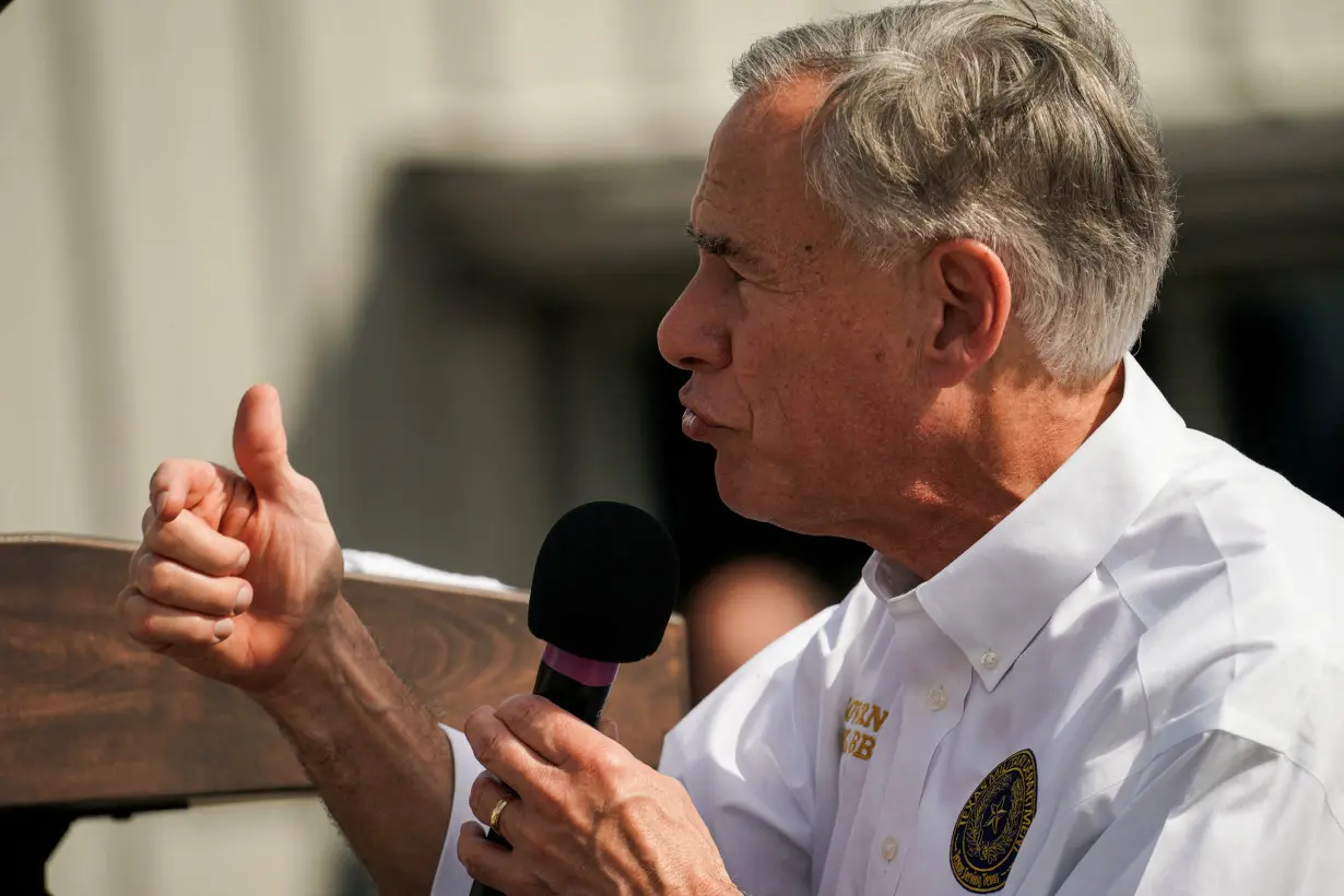 FILE PHOTO: Trump visits the southern border with Texas Governor Abbott in Edinburg, TX