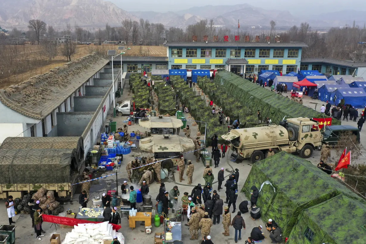 China has started erecting temporary housing units after an earthquake destroyed 14,000 homes