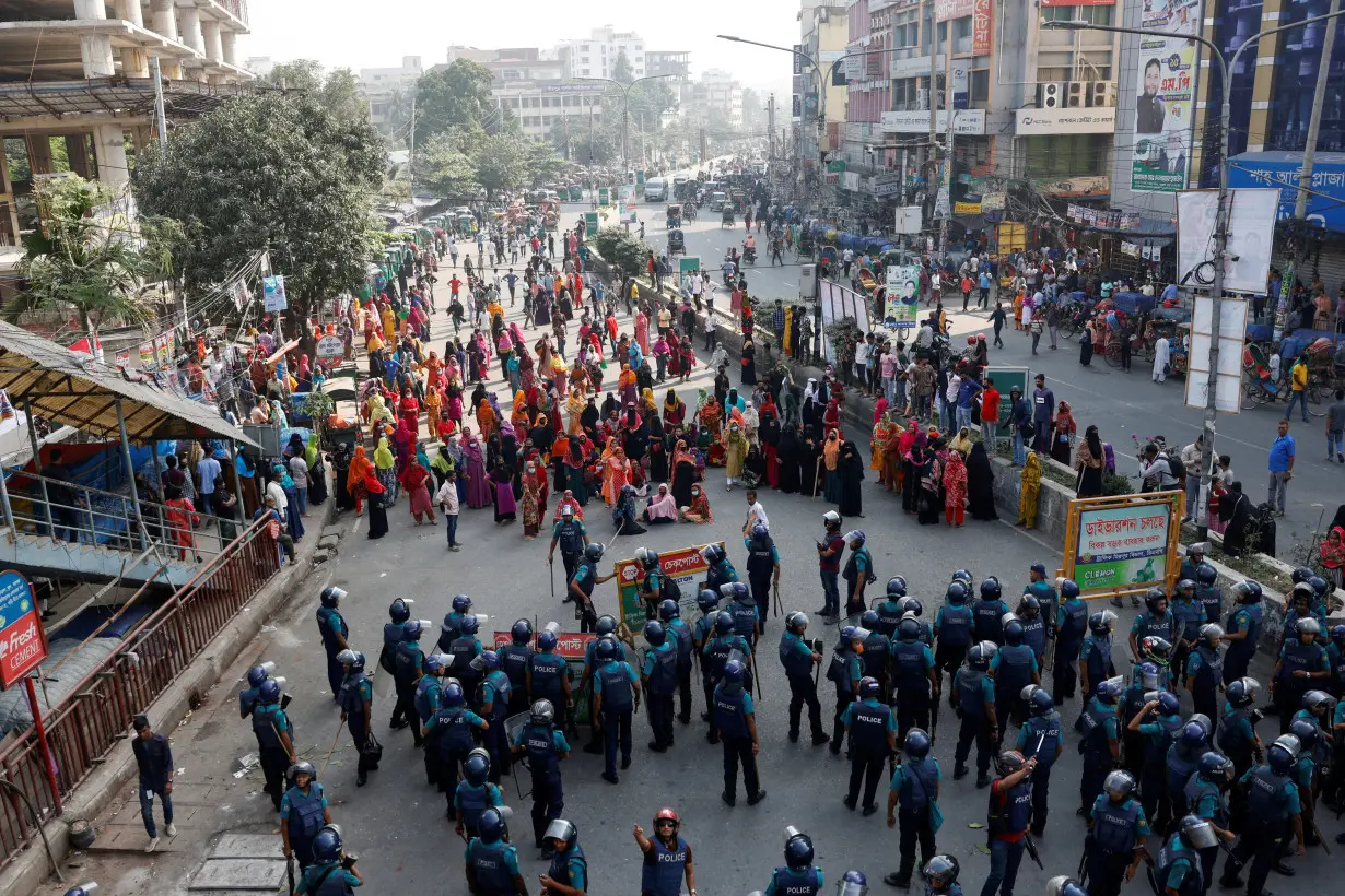 FILE PHOTO: Garment industry workers stage a protest demanding a wage raise, in Dhaka