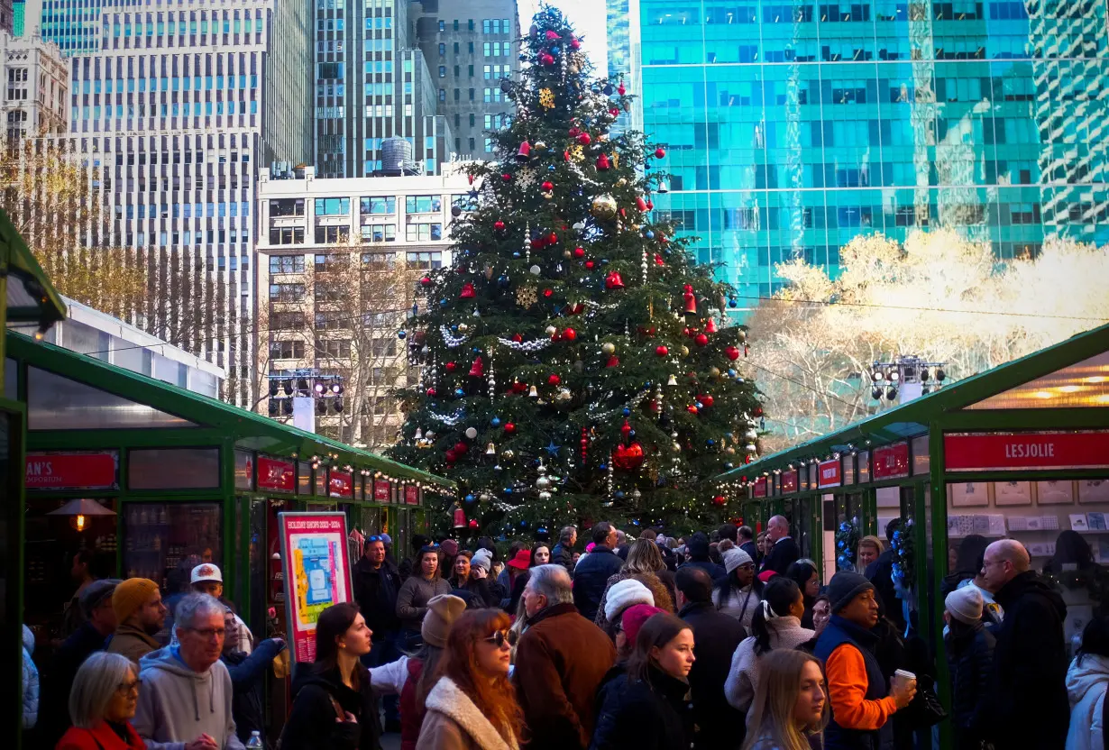 FILE PHOTO: Shoppers pack the Bryant Park Christmas shopping village in midtown Manhattan in New York