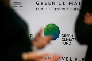 people arrive to attend the pledging conference of the green climate fund (gcf) for the first replenishment in paris