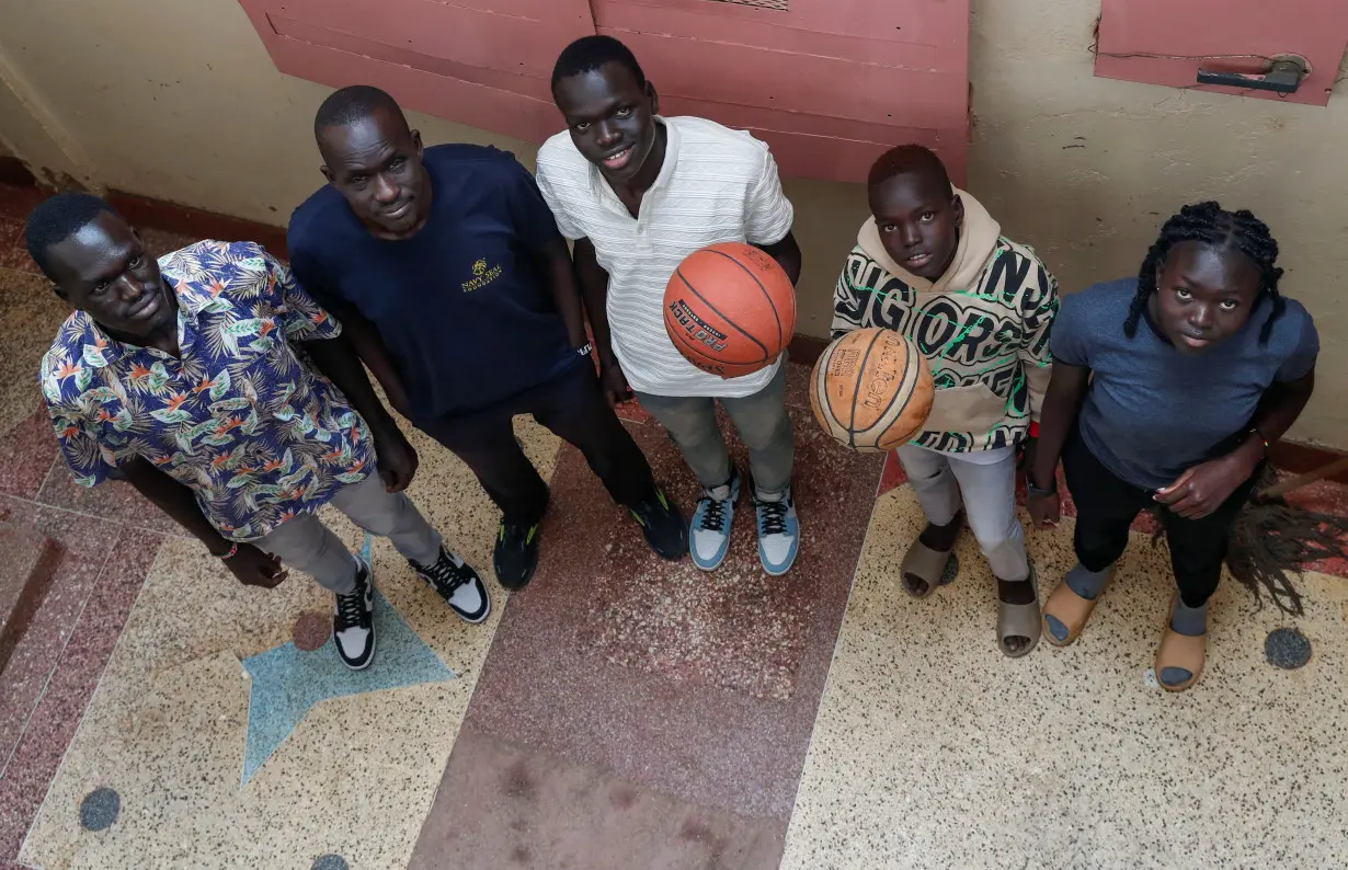 South Sudanese refugees with their American uncle Mangok Bol in Nairobi