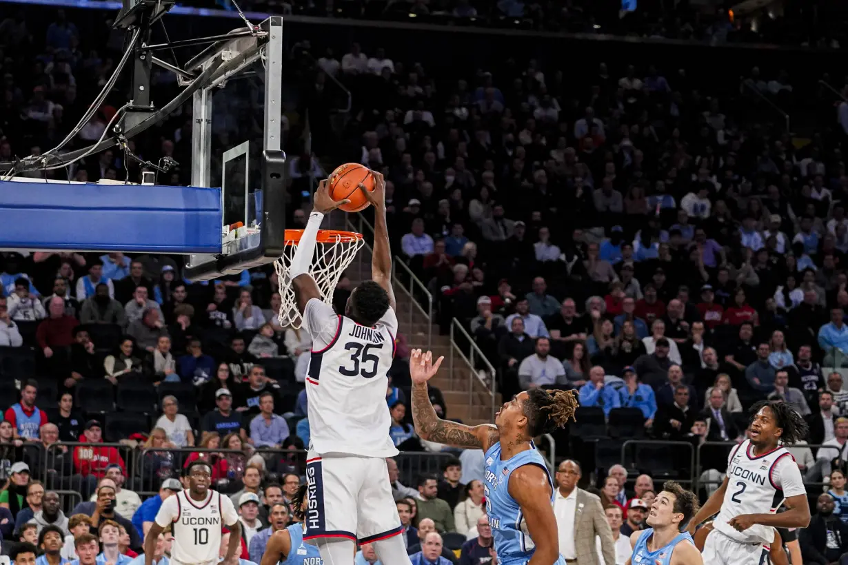 Spencer scores 23 to lead No. 5 UConn past No. 9 North Carolina 87-76 in Jimmy V Classic at MSG