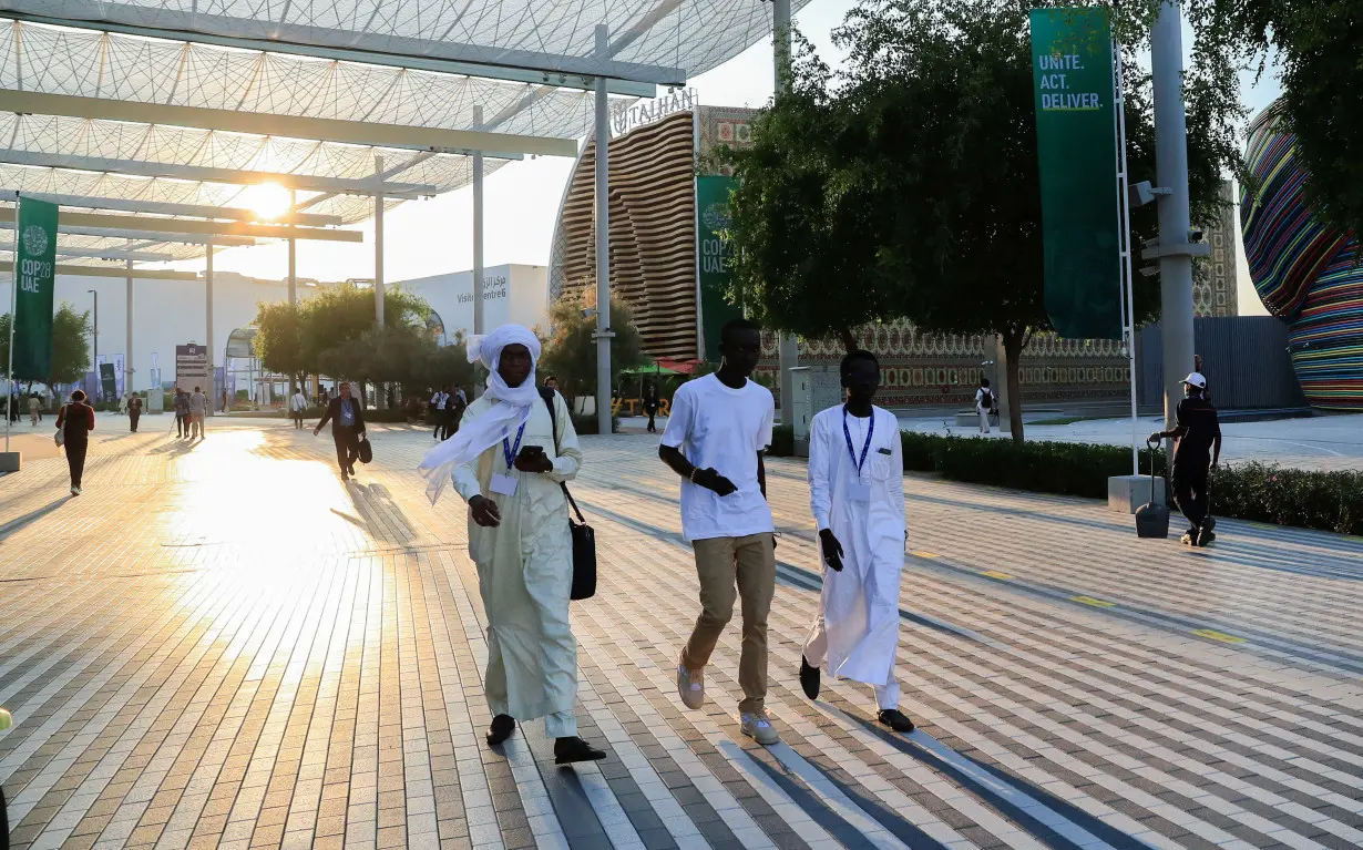 Delegates walk at the Dubai's Expo City during the United Nations Climate Change Conference (COP28) in Dubai