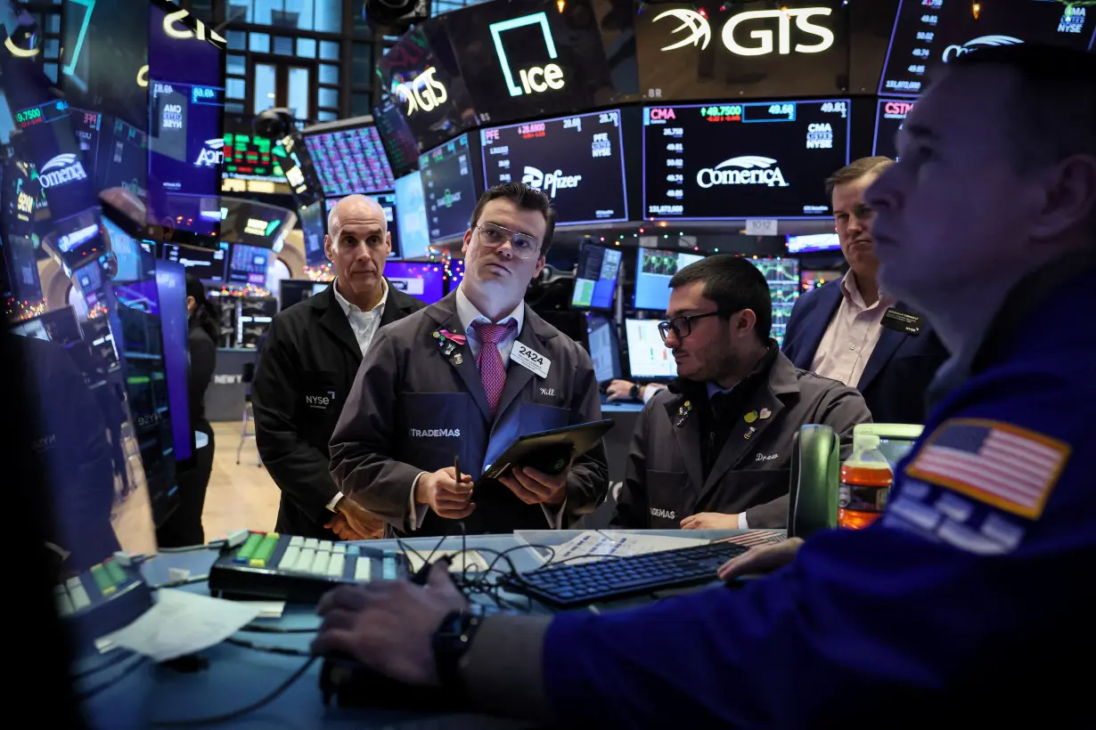 Traders work on the floor of the NYSE in New York