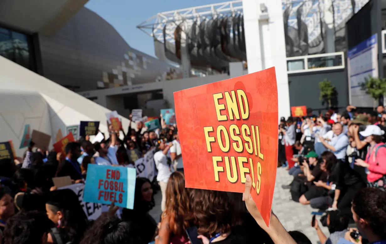 Climate activists protest against fossil fuels at Dubai's Expo City during the United Nations Climate Change Conference COP28 in Dubai