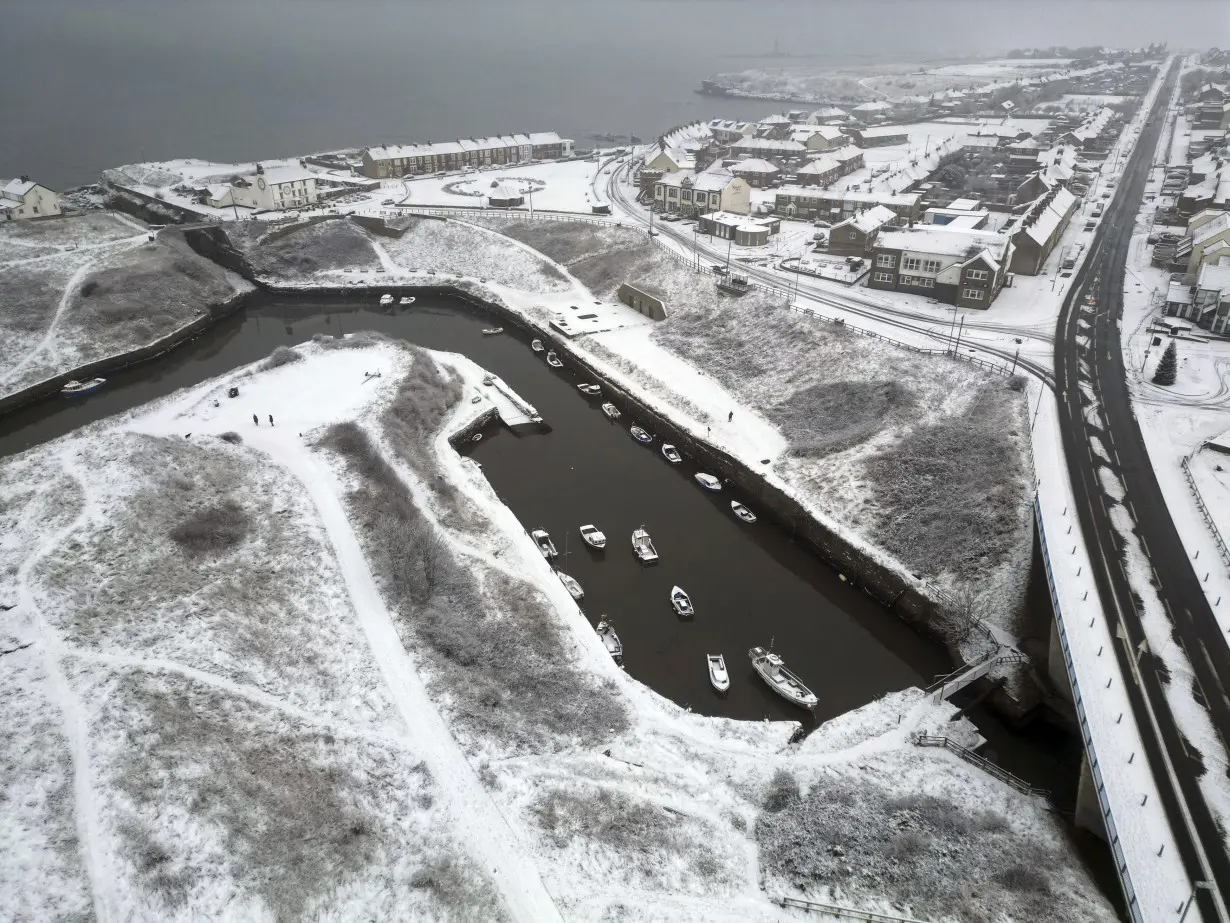 Heavy snow in northern England causes havoc on highways and knocks out power