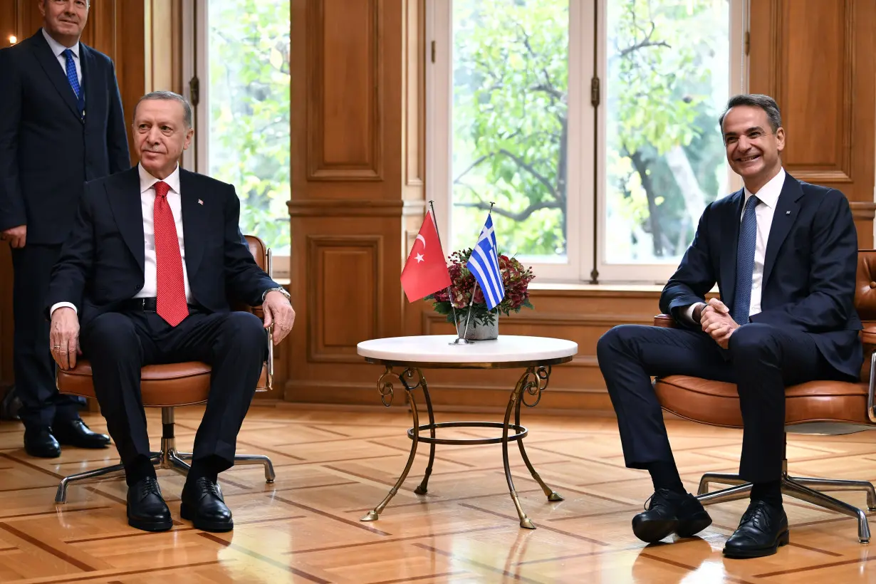 Turkish and Greek leaders turn on the charm in Athens as they vow to leave years of animosity behind