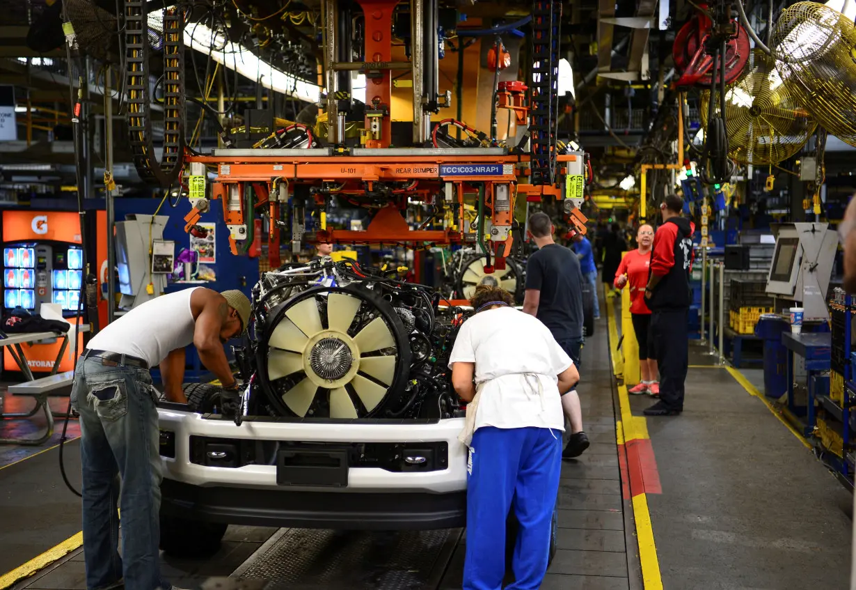 Workers assemble a Ford truck at the new Louisville Ford truck plant in Louisville