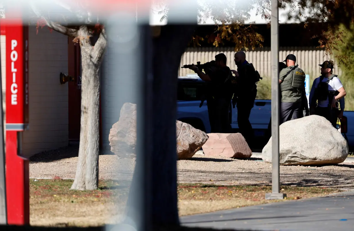 Law enforcement officers head into UNLV campus after reports of an active shooter in Las Vegas