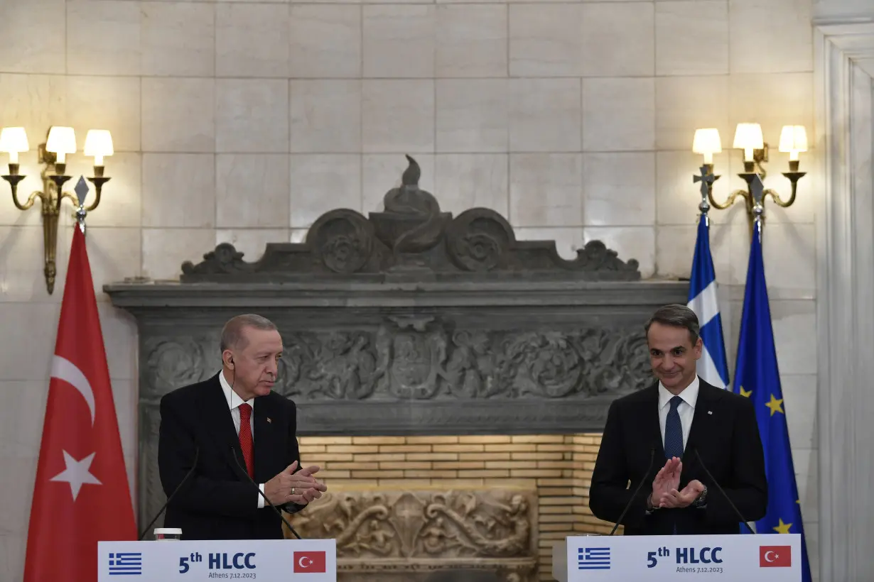 Turkish and Greek leaders turn on the charm in Athens as they vow to leave years of animosity behind