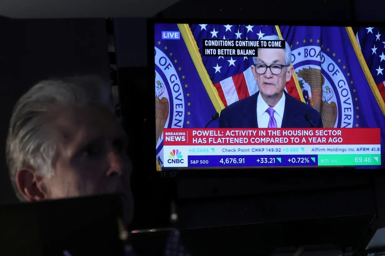 Traders react to Fed rate announcement on the floor of the NYSE in New York