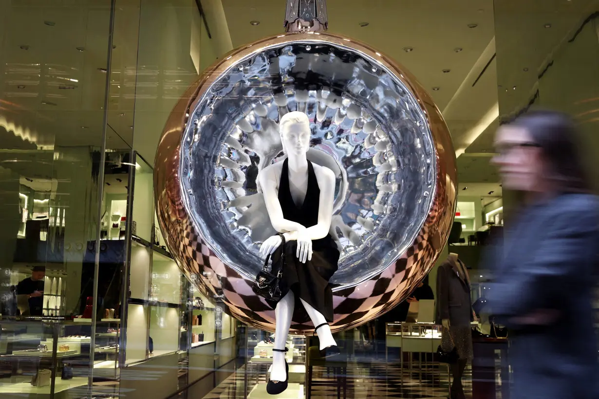 FILE PHOTO: Mannequin is pictured in a giant ornament in Christmas display window at Prada in New York