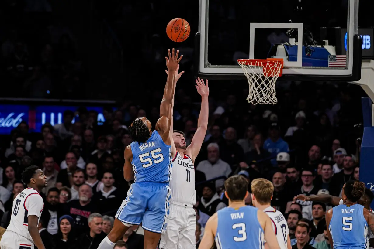 Spencer scores 23 to lead No. 5 UConn past No. 9 North Carolina 87-76 in Jimmy V Classic at MSG