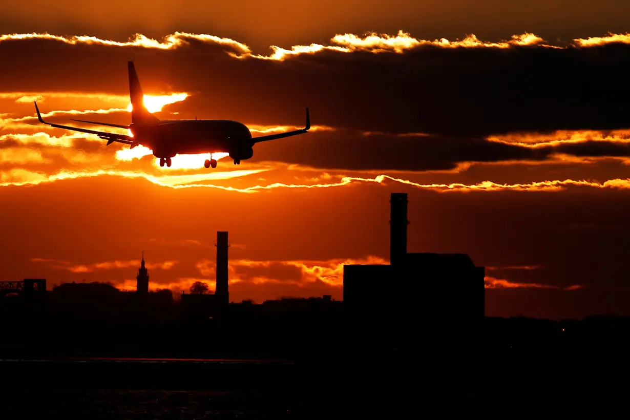 FILE PHOTO: An American Airlines flight lands at Logan International Airport in Boston