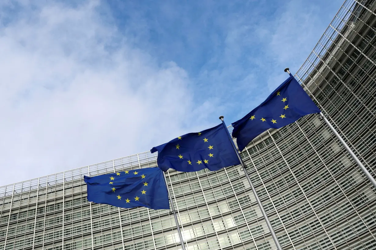 FILE PHOTO: EU flags fly outside the European Commission in Brussels