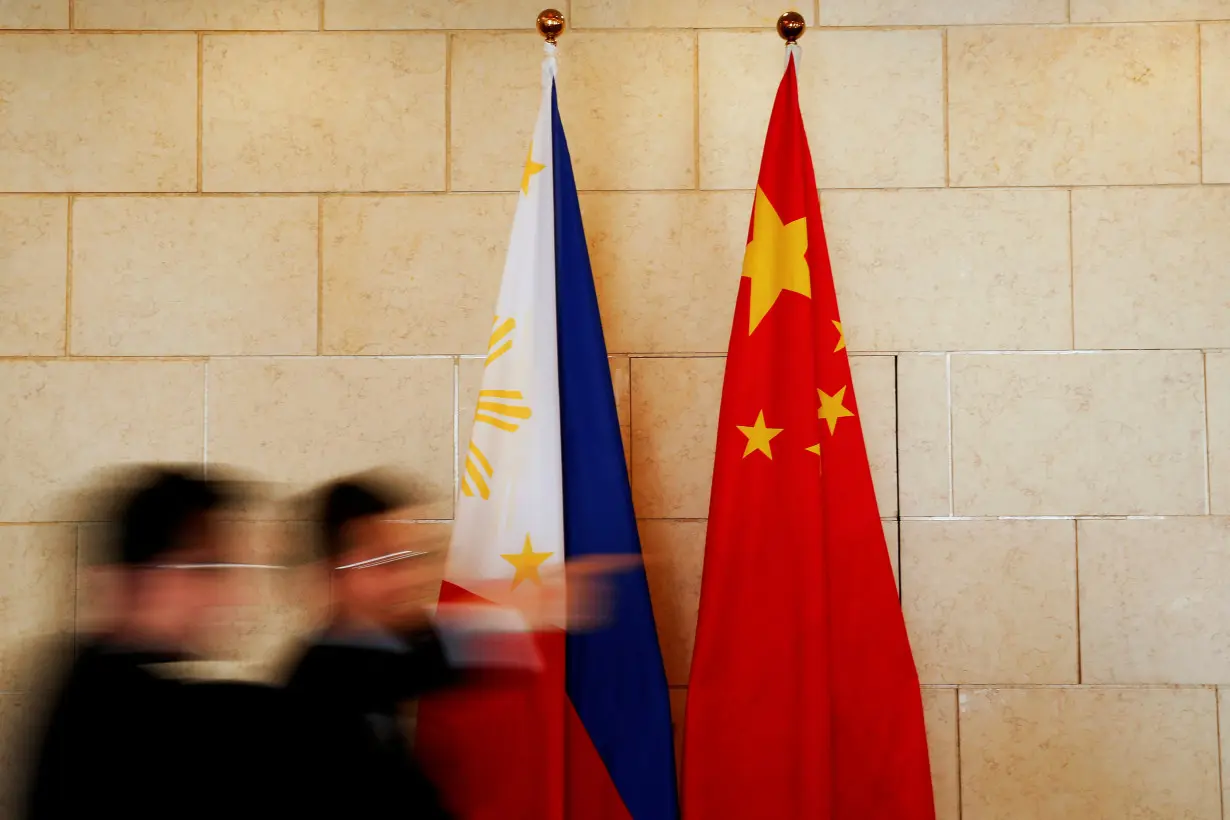 FILE PHOTO: National flags of the Philippines and China