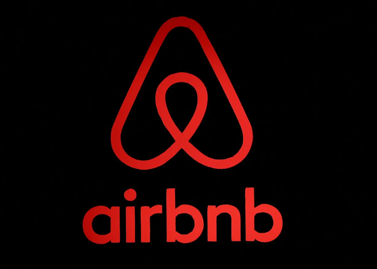 FILE PHOTO: The logo of Airbnb is displayed at an Airbnb event in Tokyo