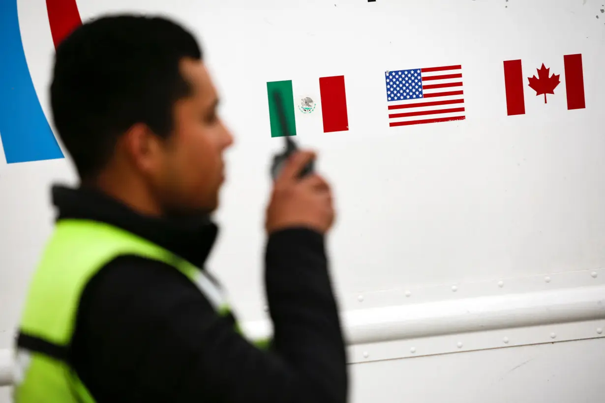 Flags of Mexico, United States and Canada are pictured at a security booth at Zaragoza-Ysleta border crossing bridge, in Ciudad Juarez