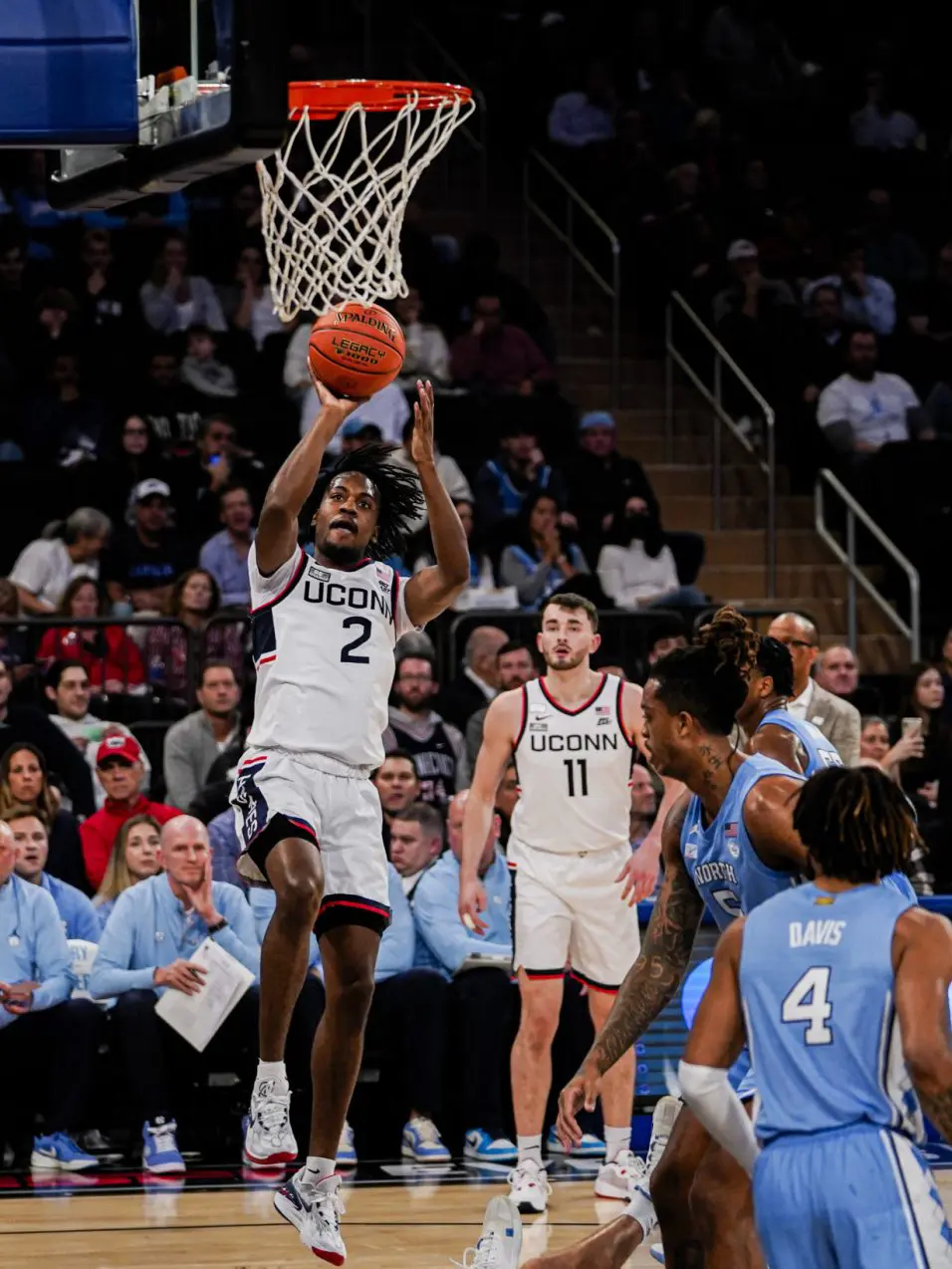 Spencer scores 23 to lead No. 5 UConn past No. 9 North Carolina 87-76 in Jimmy V Classic at MSG