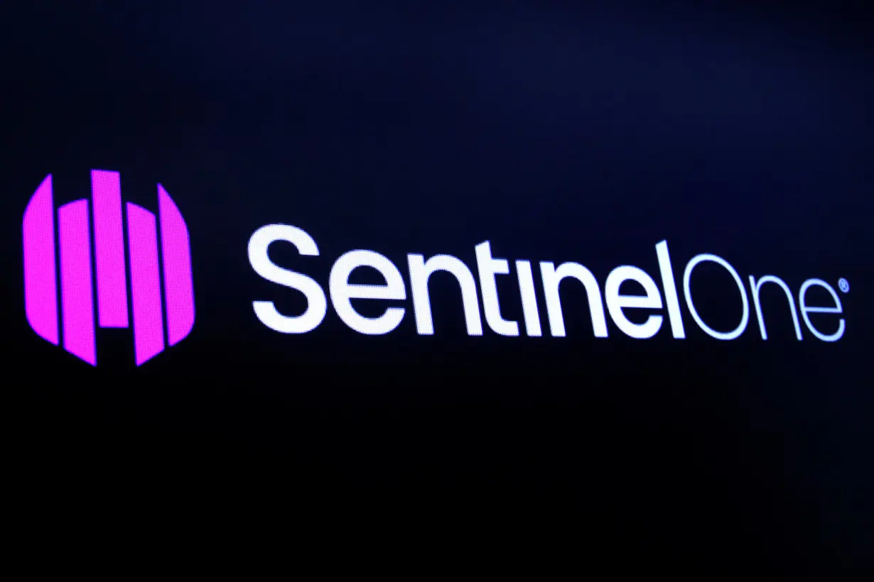 FILE PHOTO: The logo for SentinelOne Inc, a cybersecurity firm, is displayed on a screen during the company’s IPO at the NYSE in New York