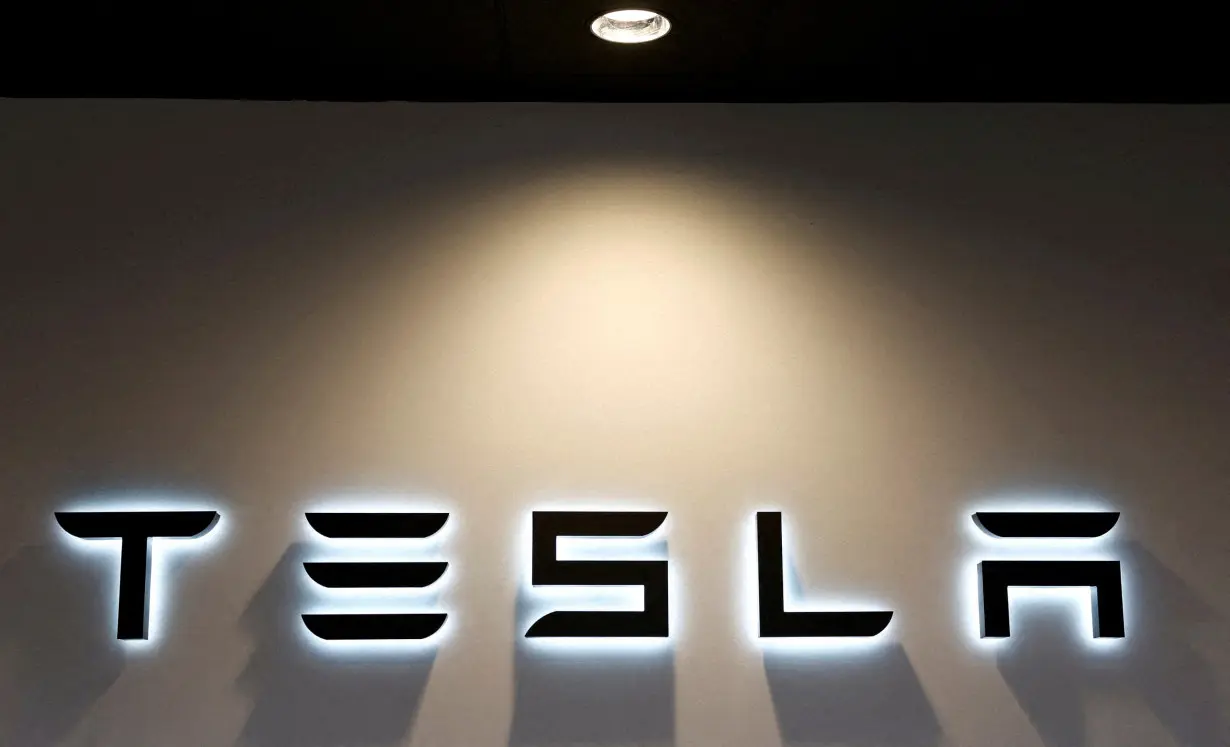 FILE PHOTO: Logo of Tesla at an electric vehicle dealership in Durango, Spain