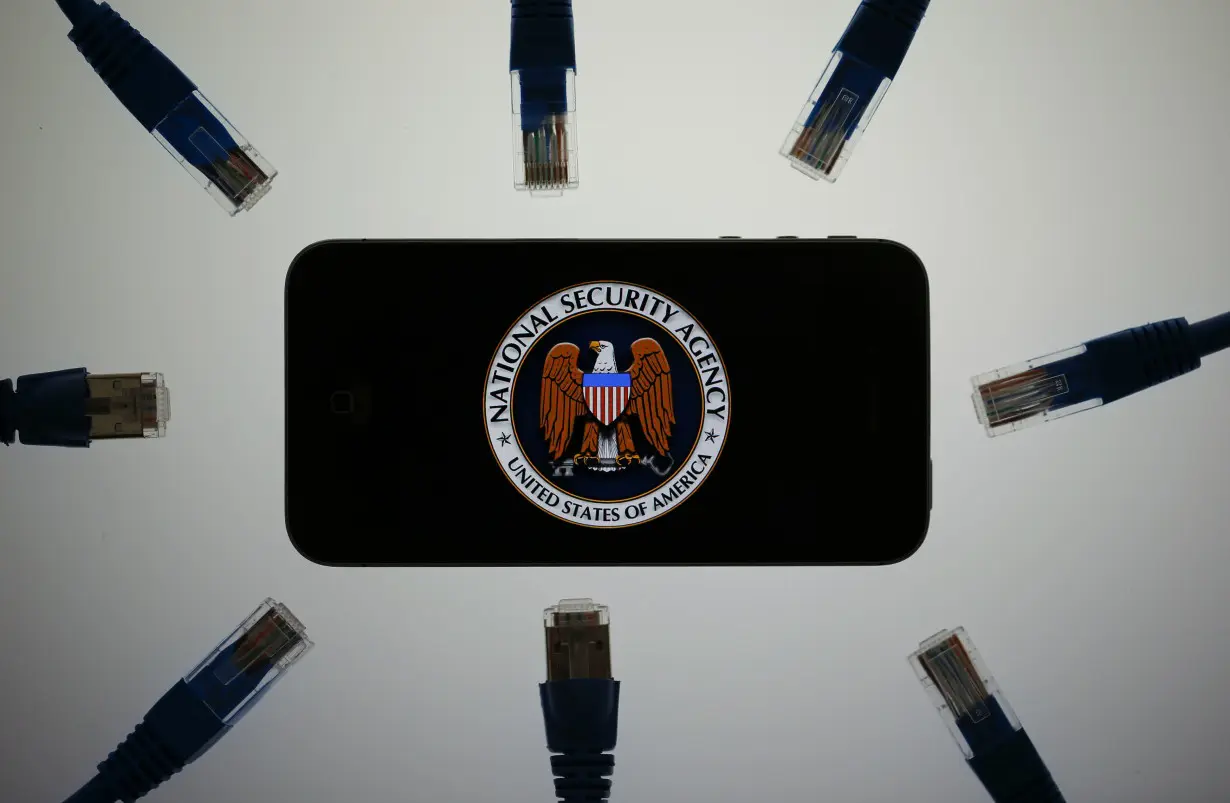 An illustration picture shows the logo of the U.S. National Security Agency on the display of an iPhone in Berlin