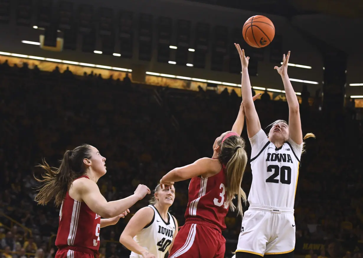 Caitlin Clark stars with 30 as No. 3 Iowa defeats No. 14 Indiana 84-57 before 13,000 despite snow